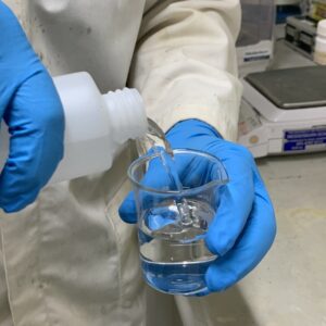 Pouring water into a beaker